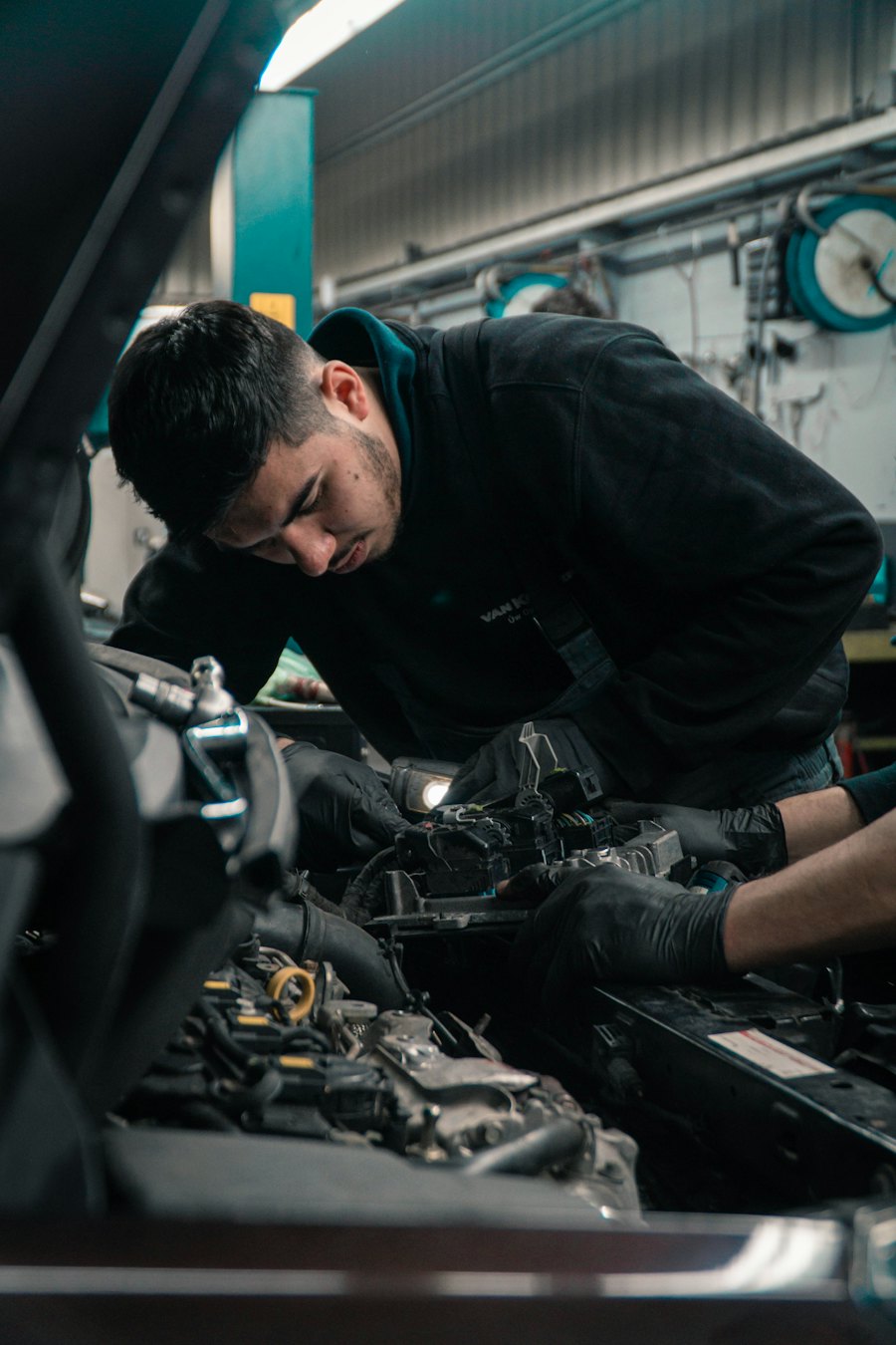 Mechanic working on an engine in the workshop